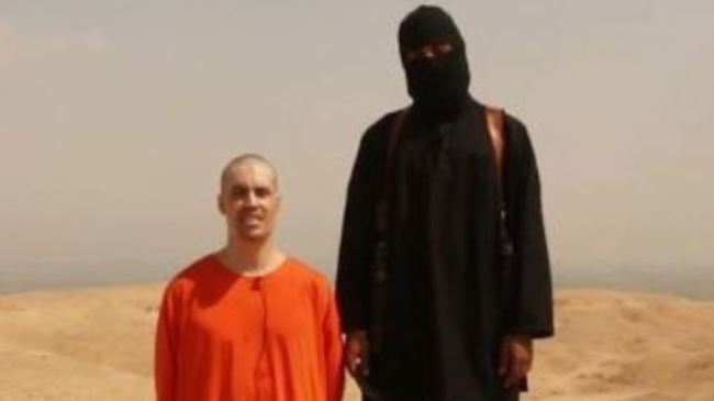 A frame grab of a graphic video showing American freelance journalist James Foley (seen on the left) being decapitated by a terrorist.